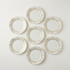 Overhead view of all seven Haviland Chambord plates arranged separately to show the complete set quantity.
