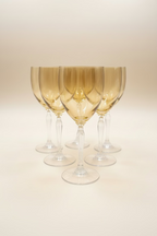 Set of 6 Pier 1 P1C1 amber blown glass water goblets with clear stems in excellent condition on an invory background. 