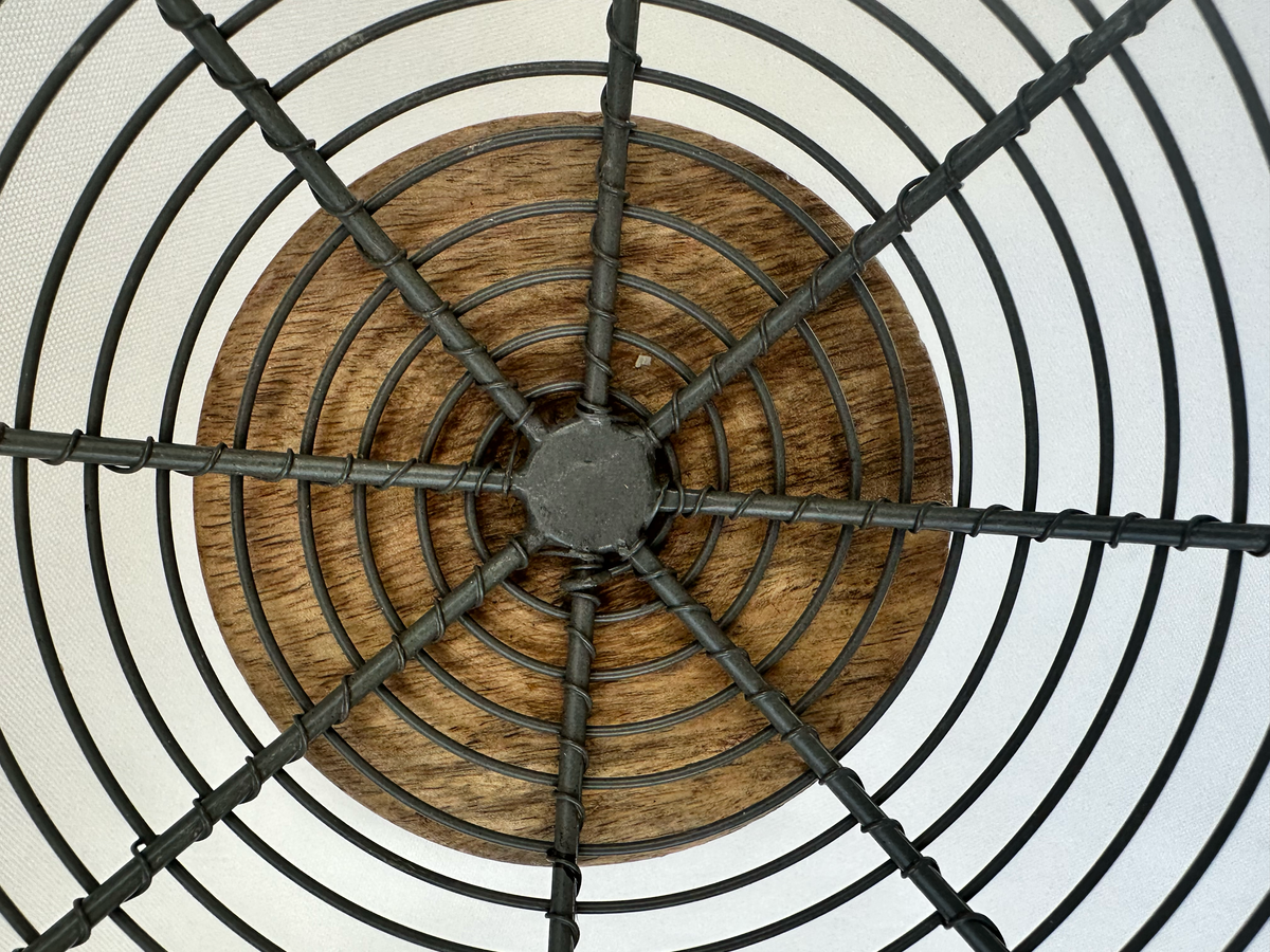 Close-up of wire framework and central attachment inside the pedestal bowl.