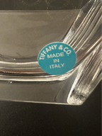 A close-up of Metropolis crystal bowl, showing a blue circular sticker that reads 'TIFFANY & CO MADE IN ITALY'.