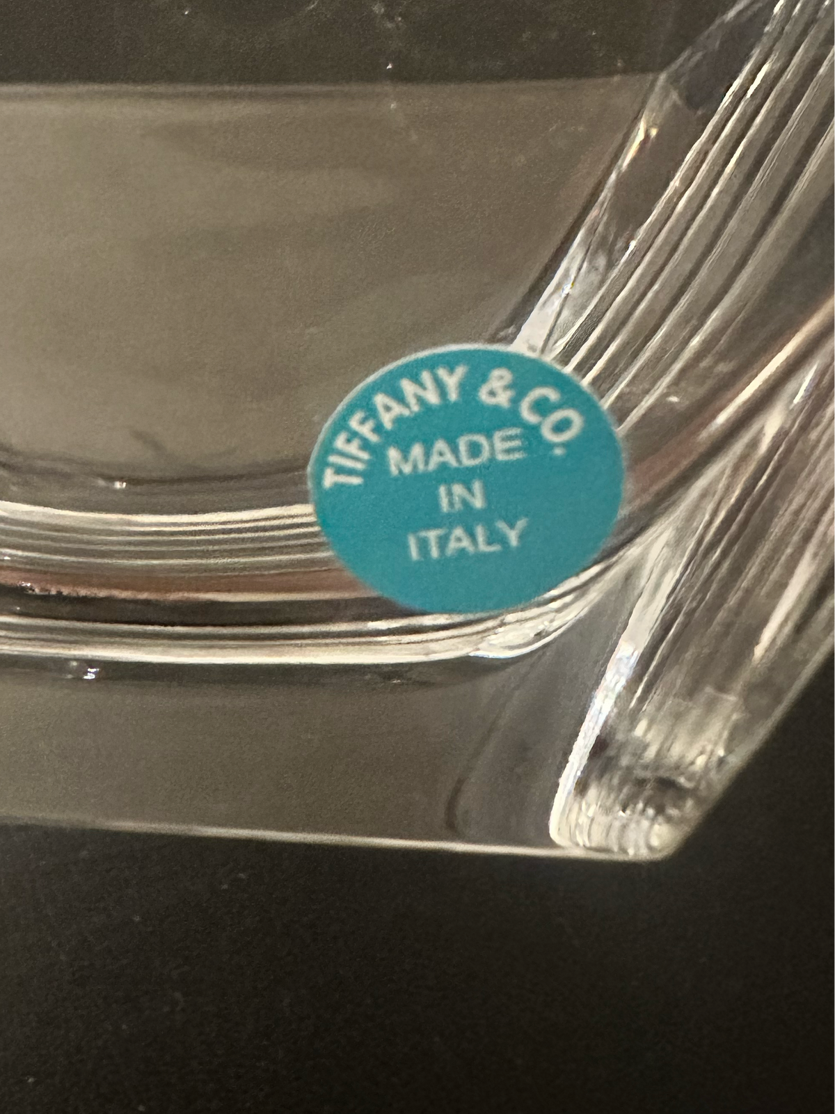 A close-up of Metropolis crystal bowl, showing a blue circular sticker that reads 'TIFFANY & CO MADE IN ITALY'.