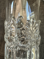 Close up of glass with mark MMA identifying them as reproductions from history. 