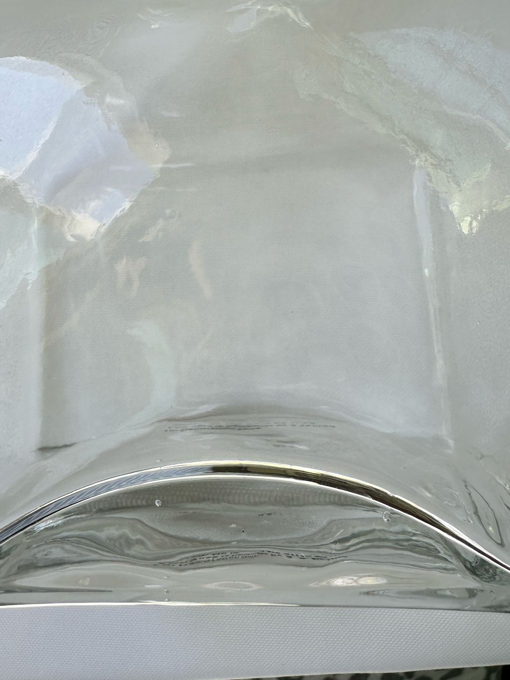 Condition photo: small bubbles present at base