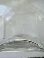 Condition photo: small bubbles present at base
