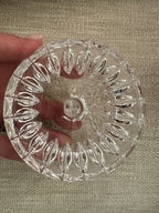 Inside the lid of the Gorham apple candy dish on a woven linen background.