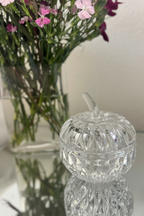 Vintage Gorham lead crystal apple candy dish with lid in discontinued Althea pattern, displayed on a a mirrored tabletop. 