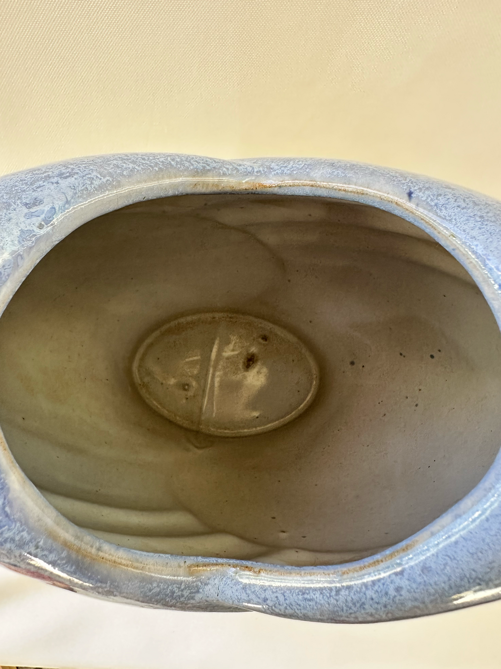 Interior view of ceramic studio pottery vase showing the glazed opening and interior base area.
