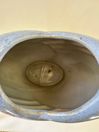 Interior view of ceramic studio pottery vase showing the glazed opening and interior base area.
