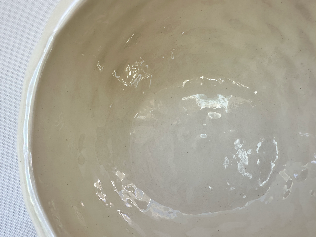 Interior view showing surface of the ceramic basket bowl. 