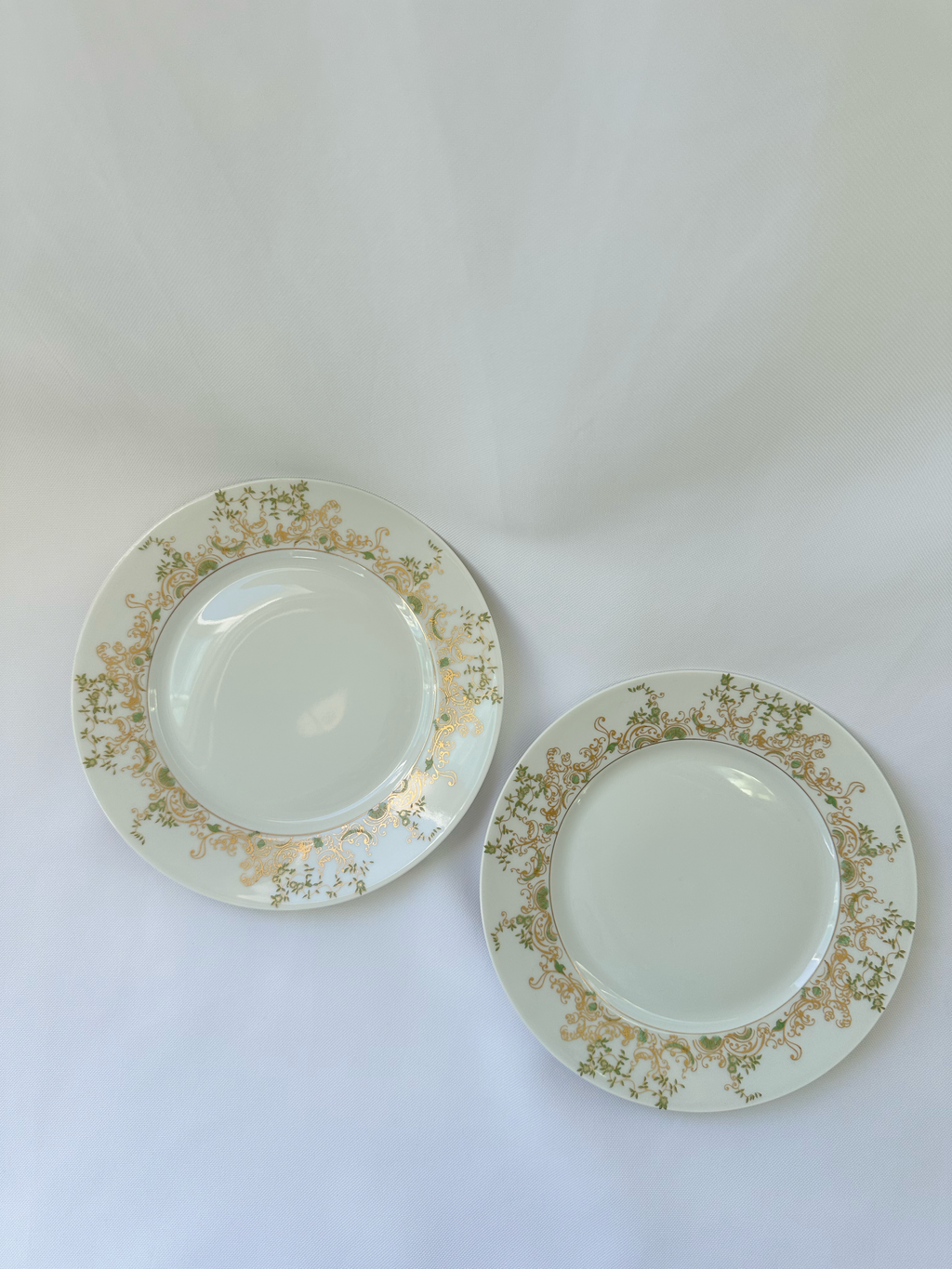 Two Haviland Limoges Chambord salad plates displayed side by side on a white backdrop.
