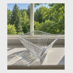Video with camera panning the Tiffany & Co Metropolis bowl sitting in the sunlight on a windowsill. 